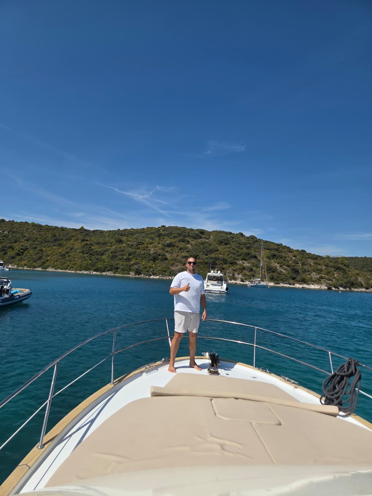 Captain Marko giving a thumbs up on the bow of Providenca